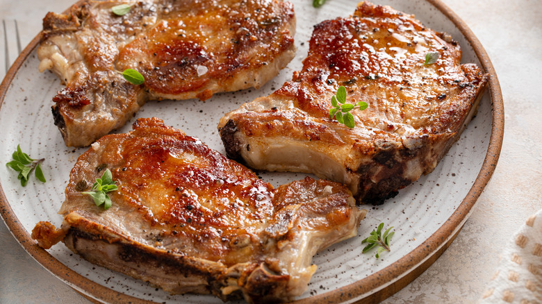 A plate of juicy, cooked pork chops.