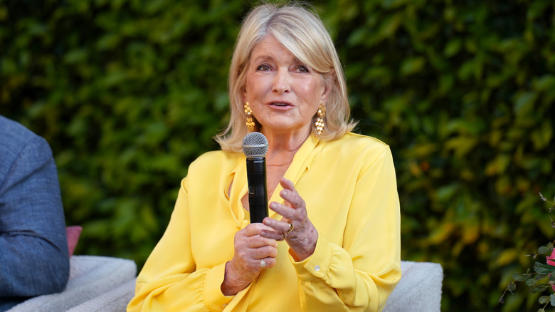Martha Stewart holding a microphone