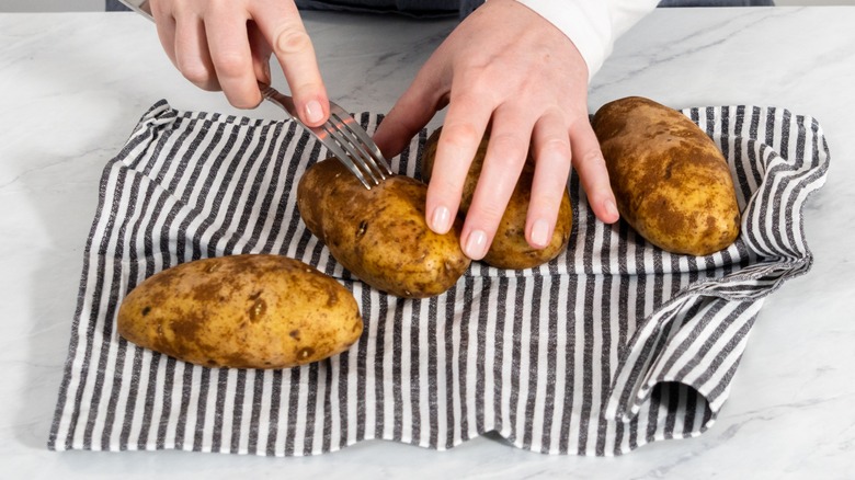 baked potatoes on kitchen towel