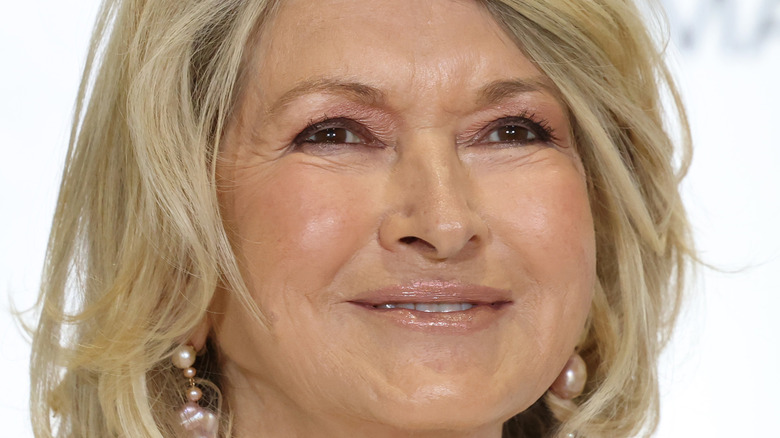 Face close up of Martha Stewart wearing pearl earrings