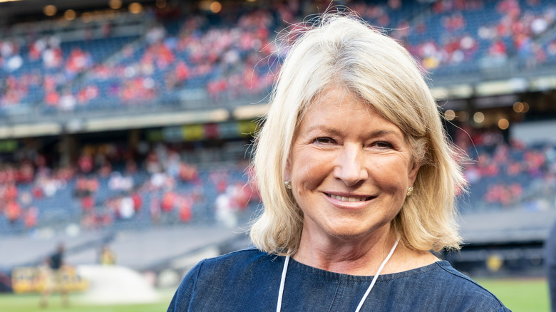 Martha Stewart smiling at an outdoor event.