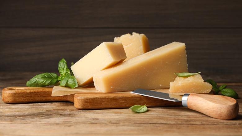 Parmesan cheese on cutting board