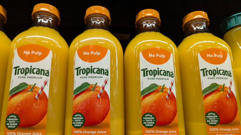 Row of Tropicana orange juice bottles