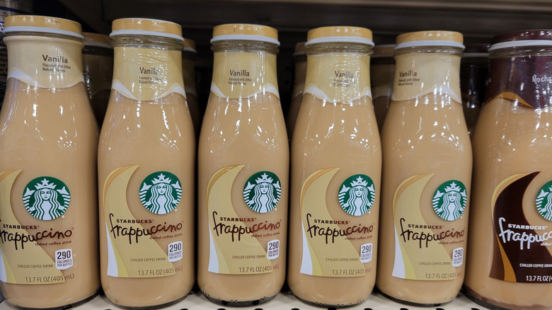 Ordered rows of Starbucks Frappuccinos on a shelf