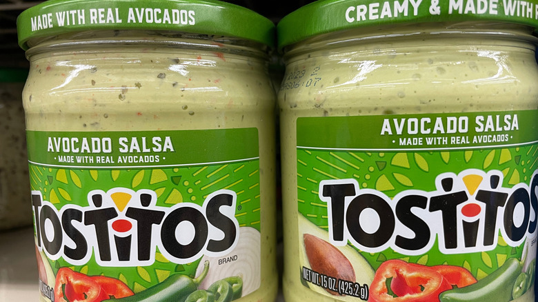 Jars of Tostitos Avocado Salsa on a store shelf
