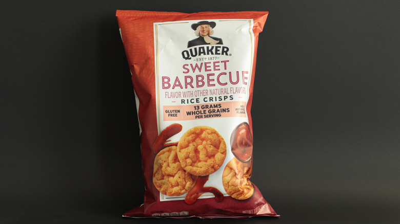 Bag of sweet barbecue flavor Quaker rice crisps before a dark background
