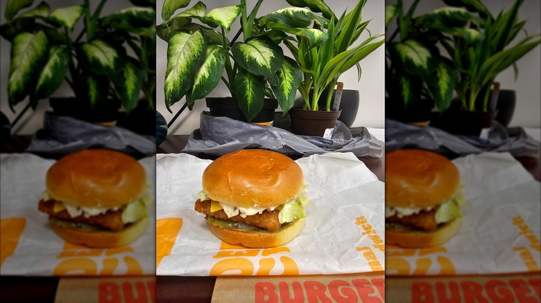 A Burger King Big Fish sandwich sits on an open wrapper