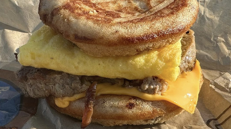 A steak and egg sandwich from McDonalds in a paper bag