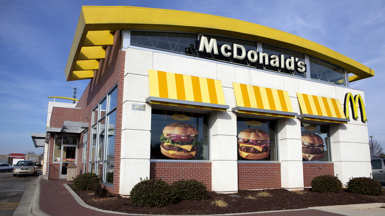 The exterior of a yellow-themed McDonald's restaurant