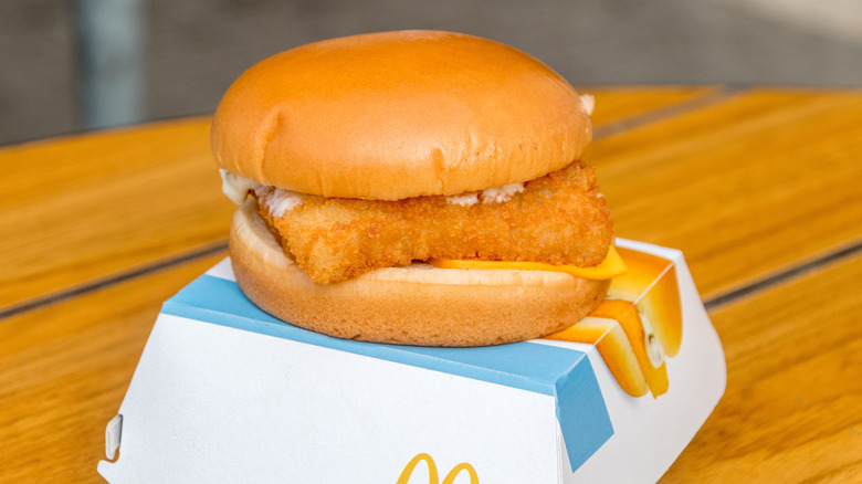 A Filet-O-Fish sits on top of its restaurant box