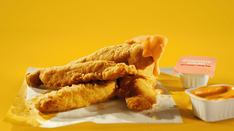 McCrispy Strips and Creamy Chili Dip on a yellow background