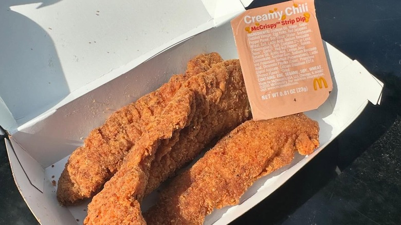 McCrispy Strips with the creamy chili strip dip in a McDonald's box