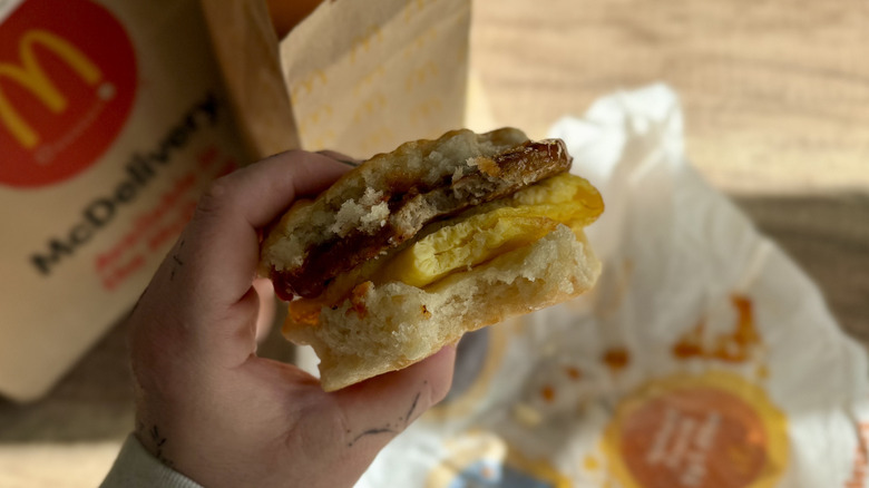 Bite taken out of Hot Honey Sausage Egg Biscuit
