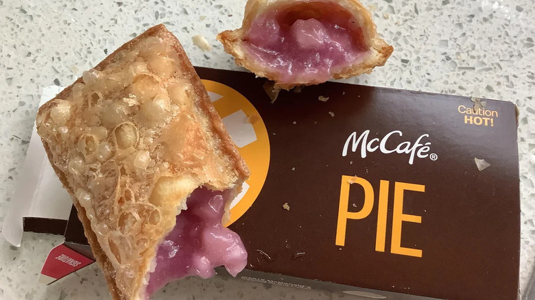 A halved McDonald's Fried Taro Pie resting on its container.