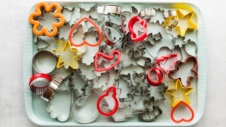 Pile of plastic and metal cookie cutters