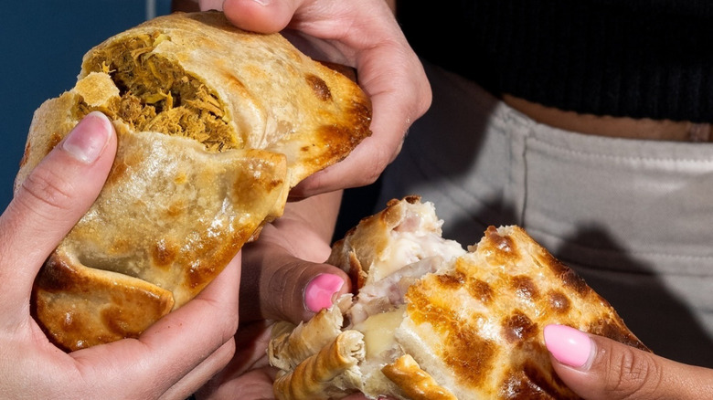 Argentinean-style chicken empanada and ham and cheese empanada.