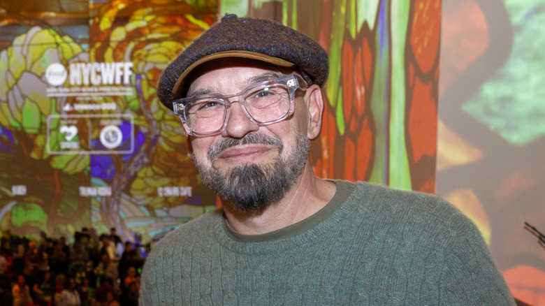 Michael Symon smiling at an event.