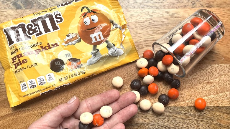 hand with Pumpkin Pie M&M's
