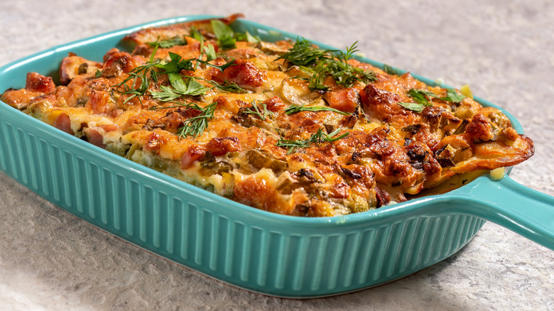 Baked potato casserole with bacon and fresh herbs