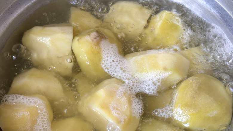 Closeup of potato chunks in boiling water