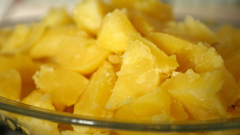 Closeup of roughed up boiled potato pieces
