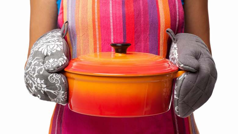 person holding casserole dish