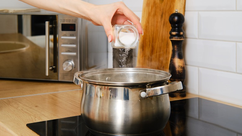 Salt going into silver pot