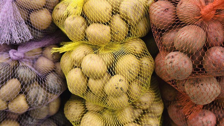 assorted whole potatoes in mesh bags