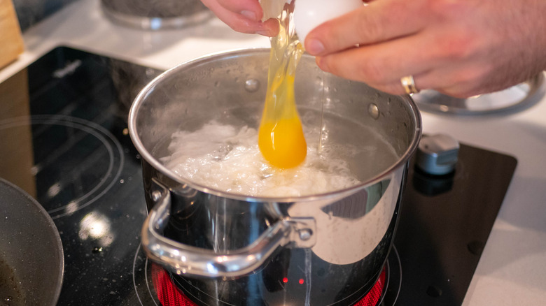 cracking egg in water