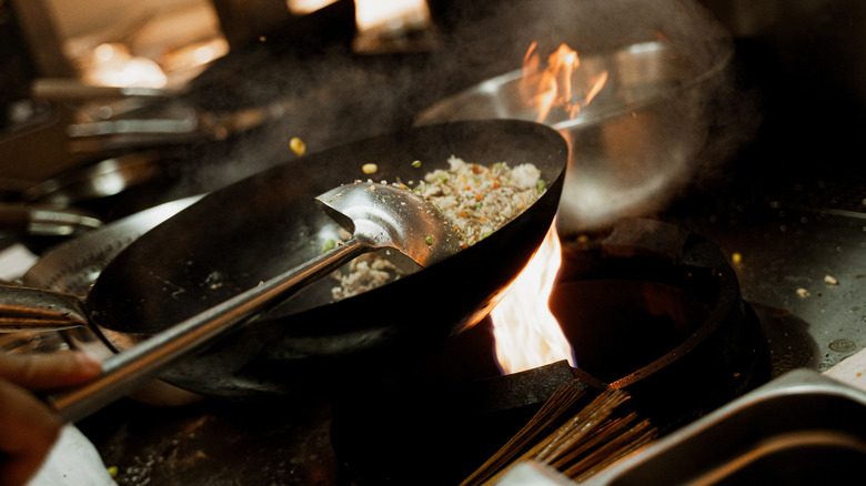 cooking fried rice in frying pan