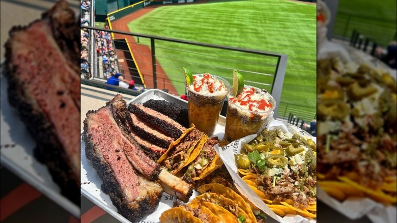 Platter with ribs, tacos, nachos, and drinks at Globe Life Field