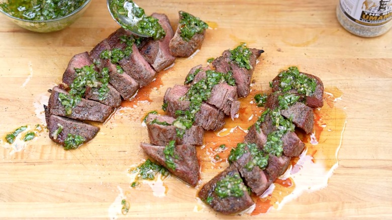 Mock tenderloin sliced and topped with chimichurri