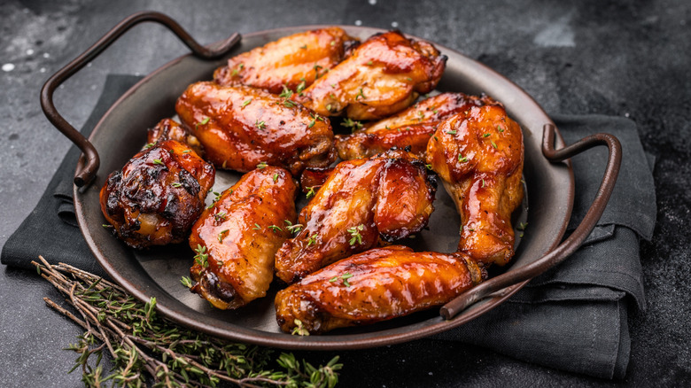 A plate of barbecue chicken wings.