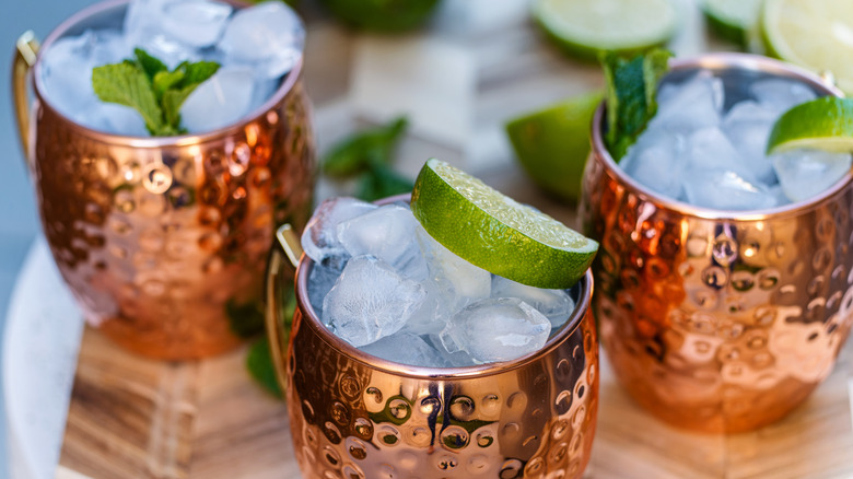 Moscow mules garnished with lime.