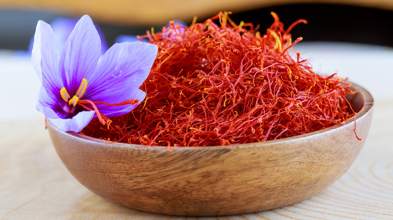Saffron with flower in wood bowl