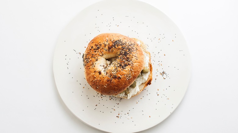 Bagel sandwich on white plate