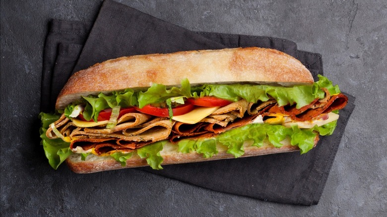 A sub sandwich against a napkin