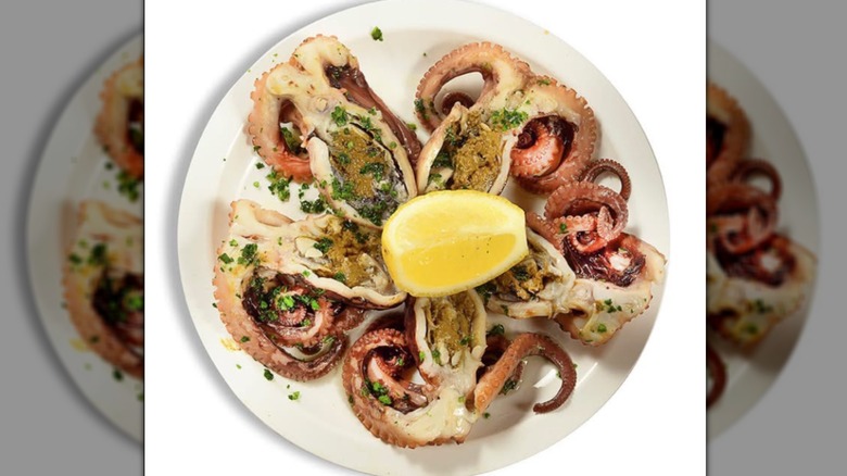 A plate of folpetti with a lemon wedge
