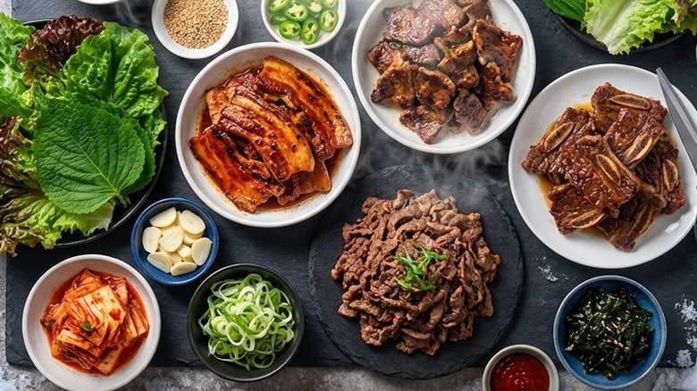 A variety of meats, sauces, and banchan from Morning House