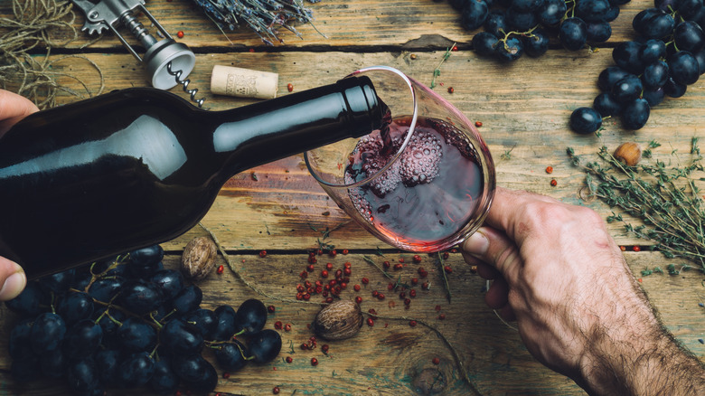 Pouring a glass of red wine