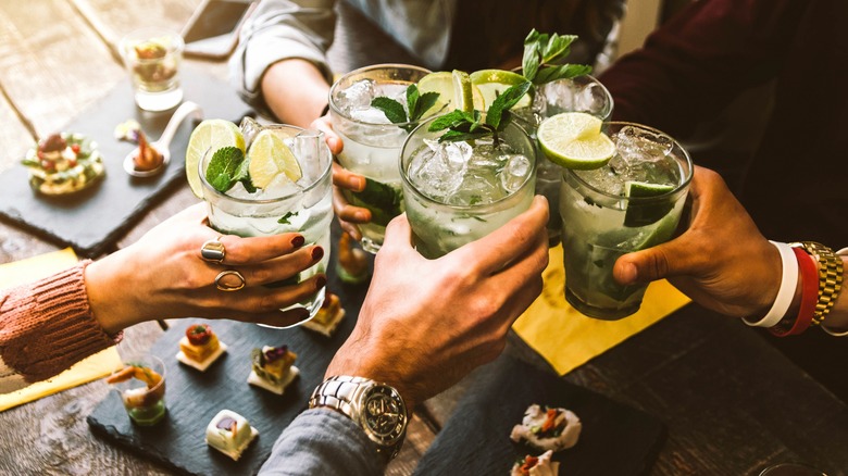 toasting drinks at dinner party