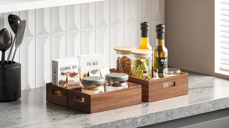 A pair of Seville Classics Acacia Storage Bins in a kitchen.