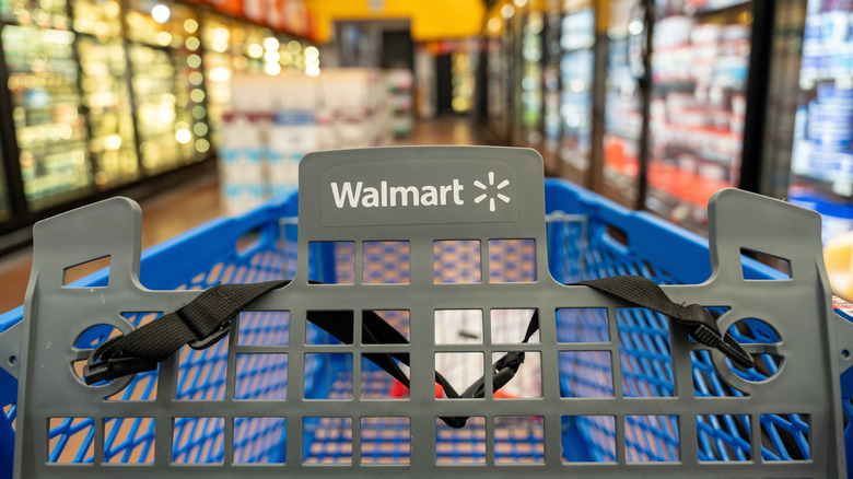 A Walmart shopping cart in the frozen aisle of Walmart