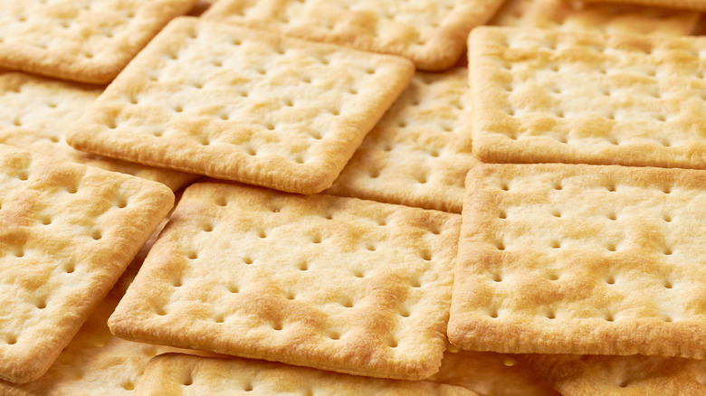a pile of saltine crackers