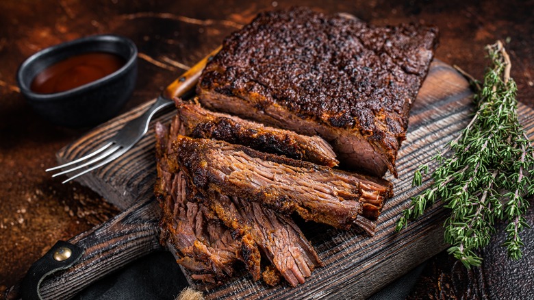Smoked brisket on a wooden board