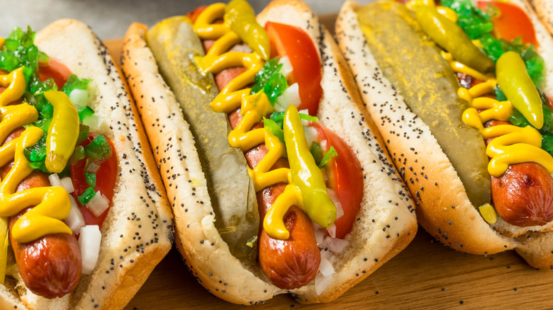Three Chicago-style hot dogs