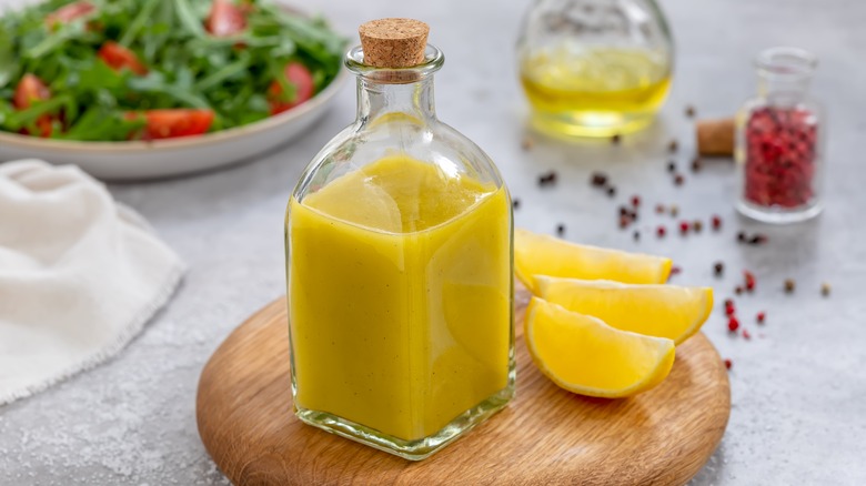 Bottle of brine or dressing with lemon slices