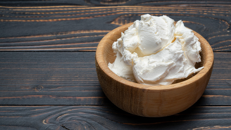A bowl of cream cheese.