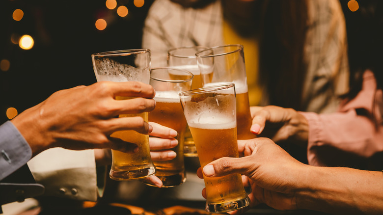 People enjoying beer in a bar.