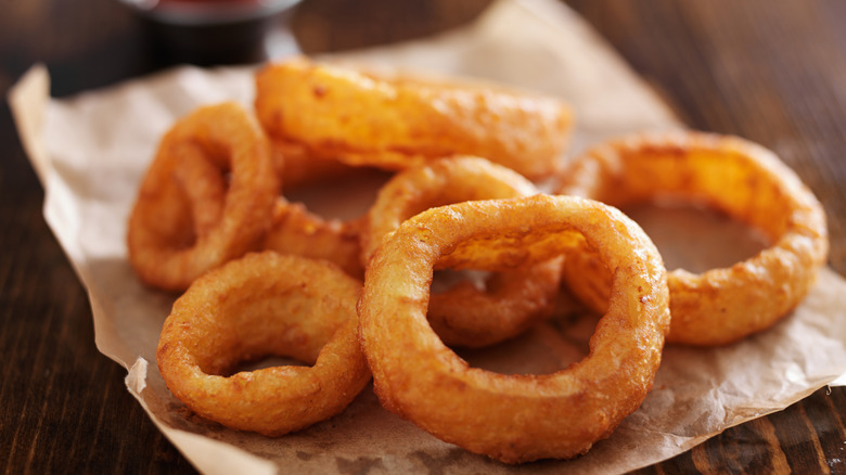 Crispy onion rings on paper.